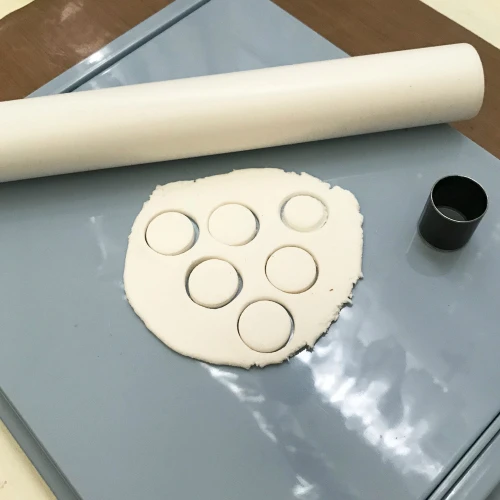 Use the clay roller kit to begin creating stepping stones for the fairy garden.